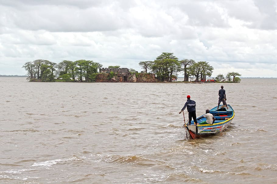 three men on blue boat sailing near island, river boat, tourism