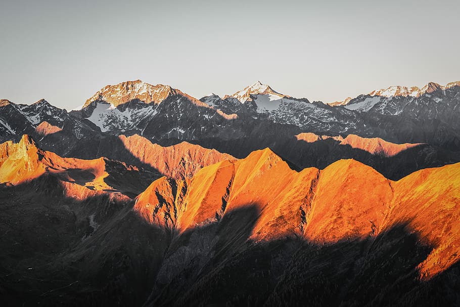 bird's eye view of mountains, landscape photography of partially snow-covered mountains HD wallpaper