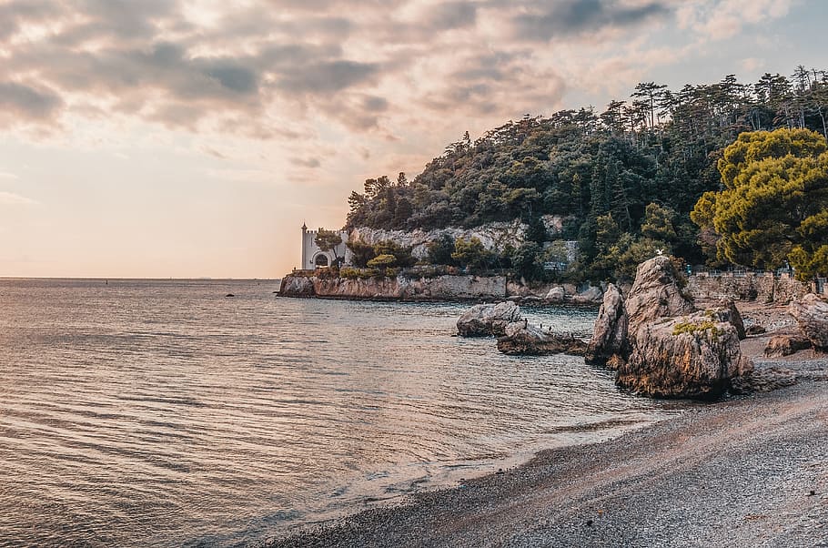 bay, beach, castle, coast, dark, clouds, dawn, daylight, horizon HD wallpaper