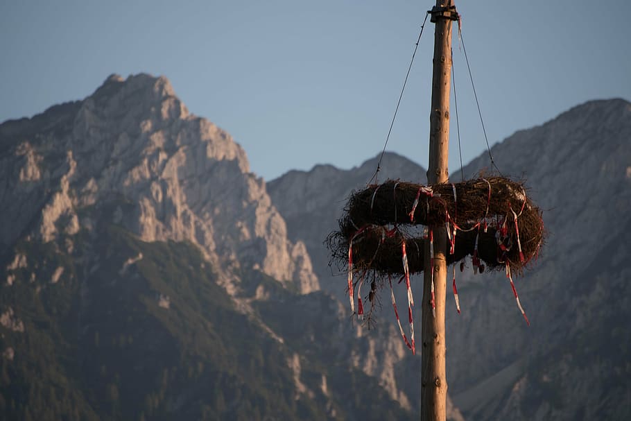mountains, rock, tyrol, customs, maypole, wreath, alpine, sky HD wallpaper