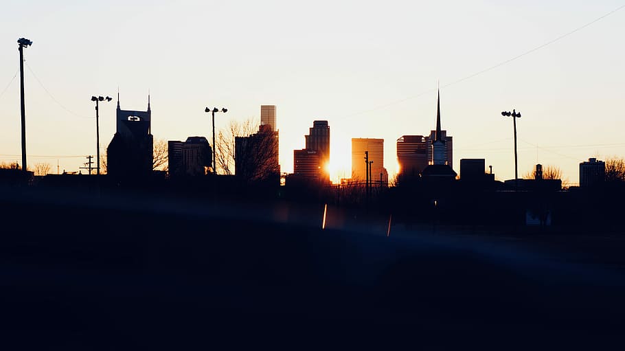 silhouette photo of city building during sunset, silhouette of city buildings golden hour photography HD wallpaper