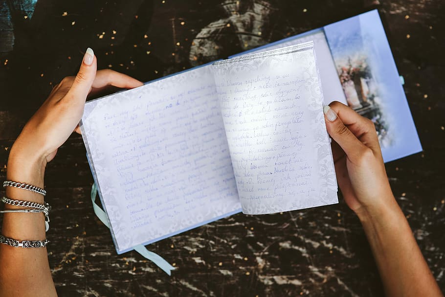 Woman reading a diary by the table, book, notebook, hands, memories HD wallpaper