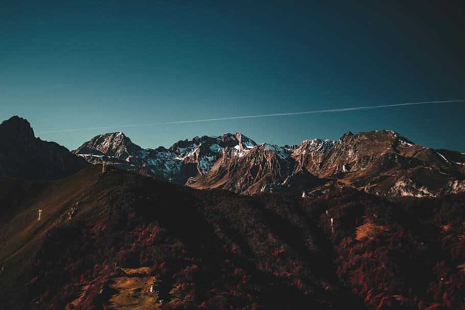 brown rocky mountain at blue hour, aerial view of mountain covered with green grass and snow under the clear sky HD wallpaper