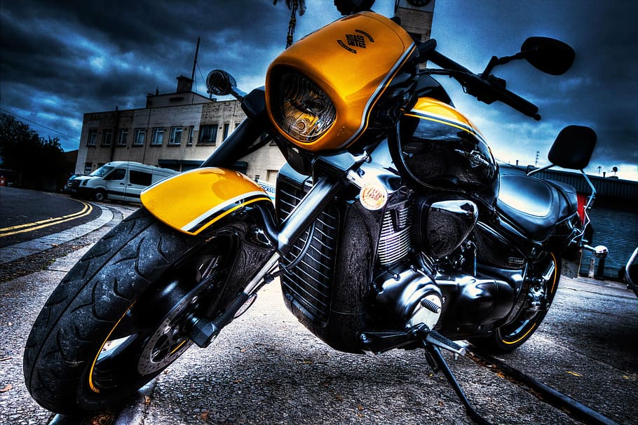 lowlight photography of yellow and black cruiser motorcycle, bike