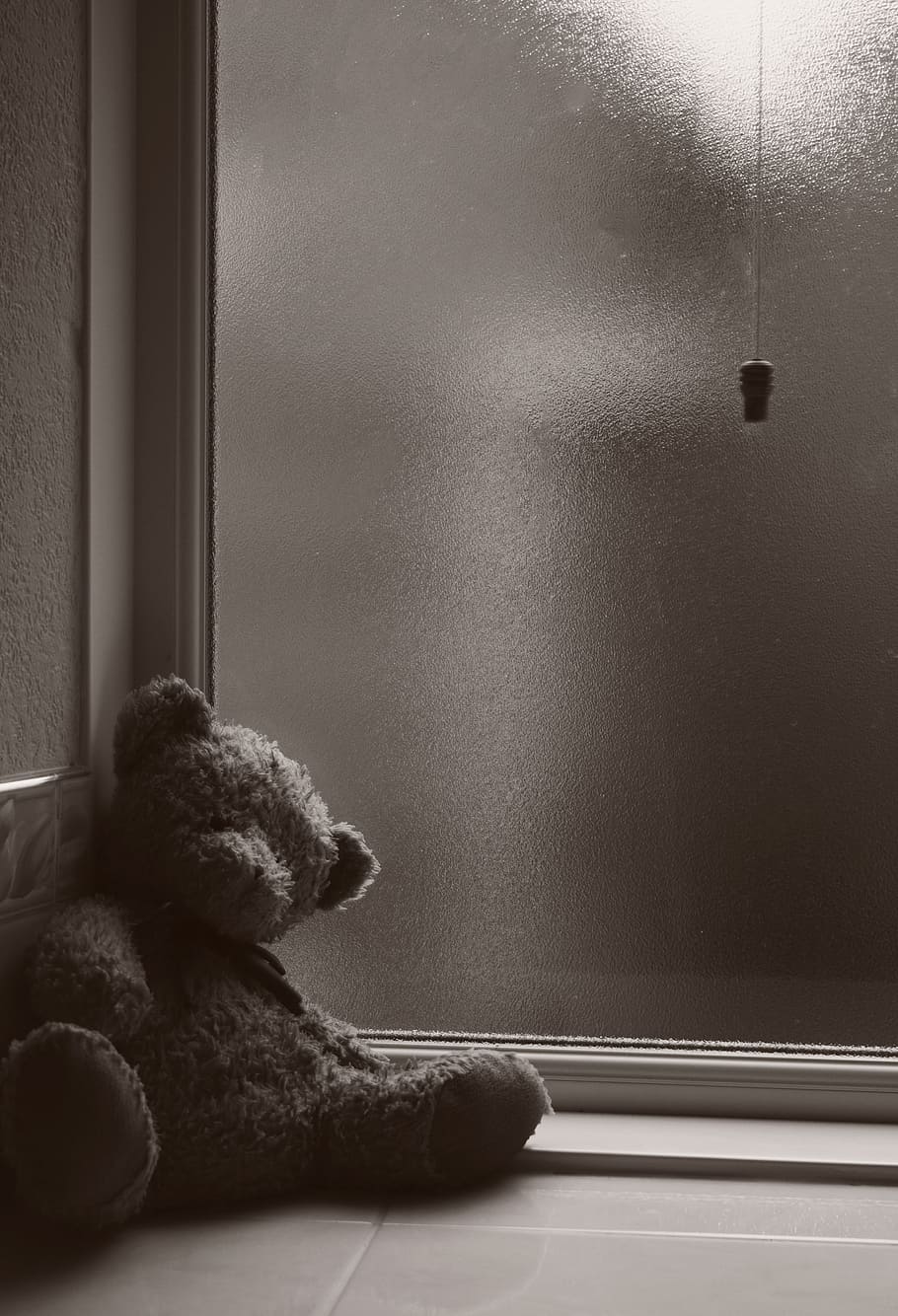 brown bear plush toy lean on wall near window, Abandoned, Cold