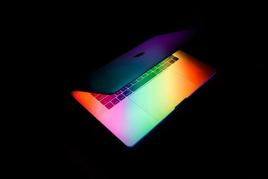 silver MacBook on black surface, MacBook Air with orange, green, and purple LED, HD wallpaper