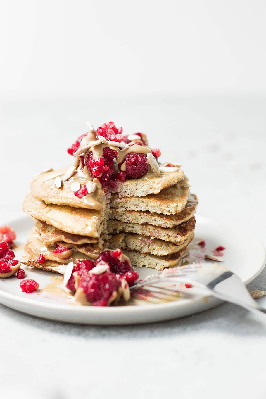 pancakes on white plate, sliced pancake on white ceramic plate HD wallpaper