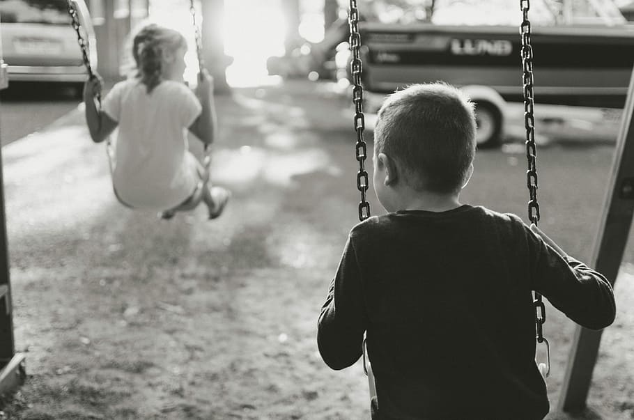 grayscale photography of boy and girl on swing, grayscale photography of girl and boy playing swing outdoor HD wallpaper