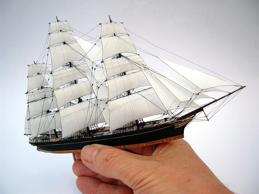 person holding white and black miniature galleon ship, Sailing, Ship HD wallpaper