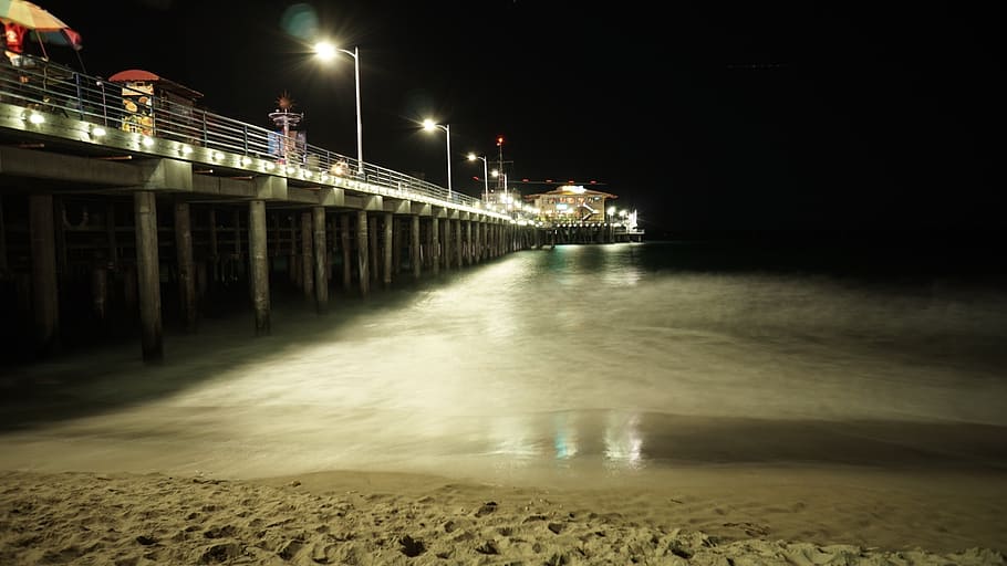 pier, beach, sand, water, shore, night, evening, lamp posts HD wallpaper