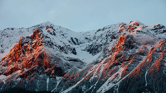 photo of mountain covered of snow during cloudy sky, white and gray mountain during daytime HD wallpaper
