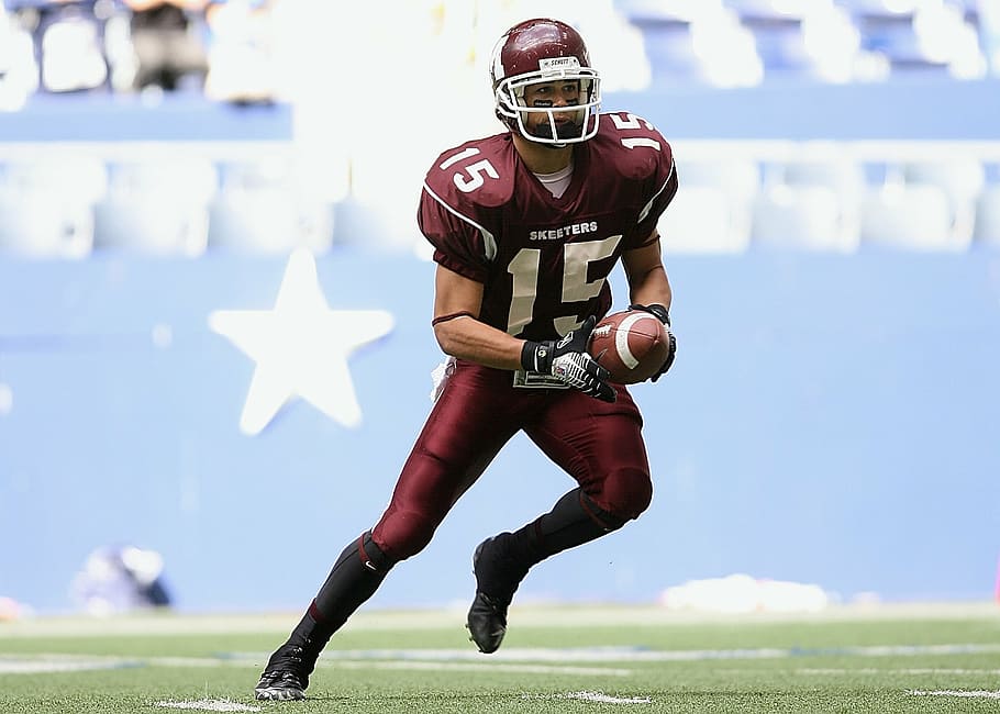 man wearing maroon and white football uniforms, player, ball carrier, HD wallpaper