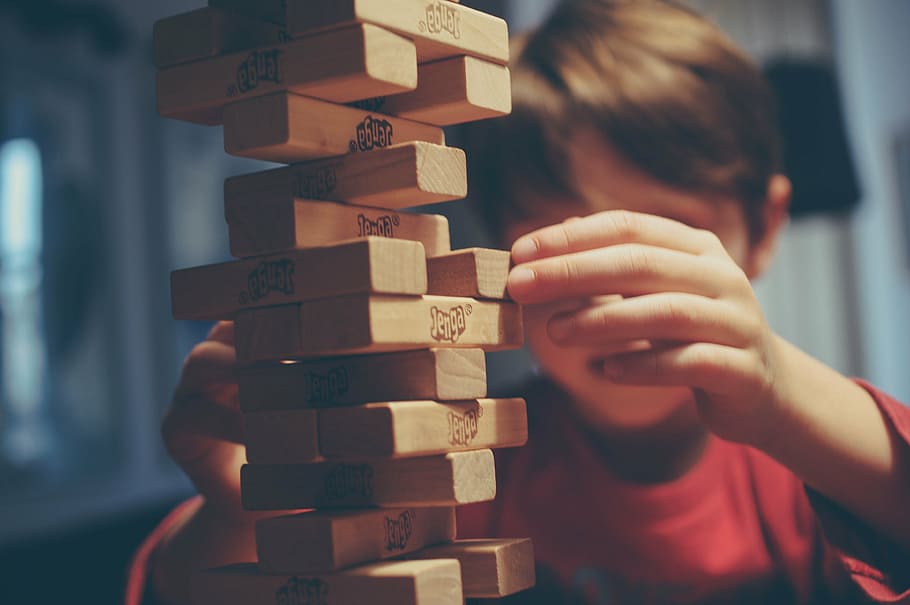 boy playing jenga blocks, game, hand, kid, child, wooden, stack
