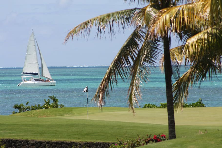golf flag in front of sailboat on blue body of water, mauritius, HD wallpaper