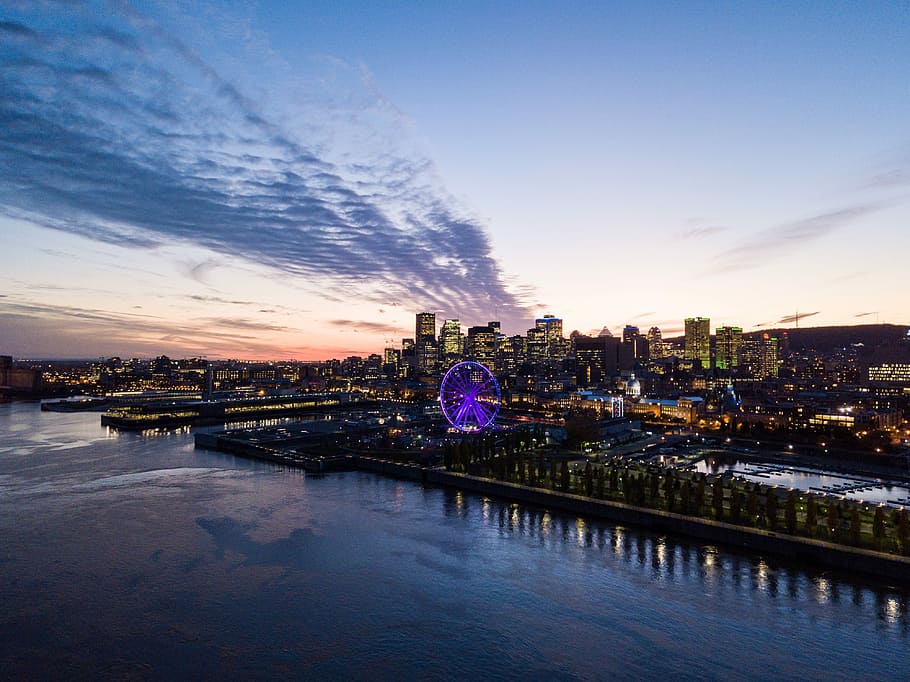 aerial photo of city buildings near bodies of water at daytime, aerial view of London Eye under cloudy sky HD wallpaper