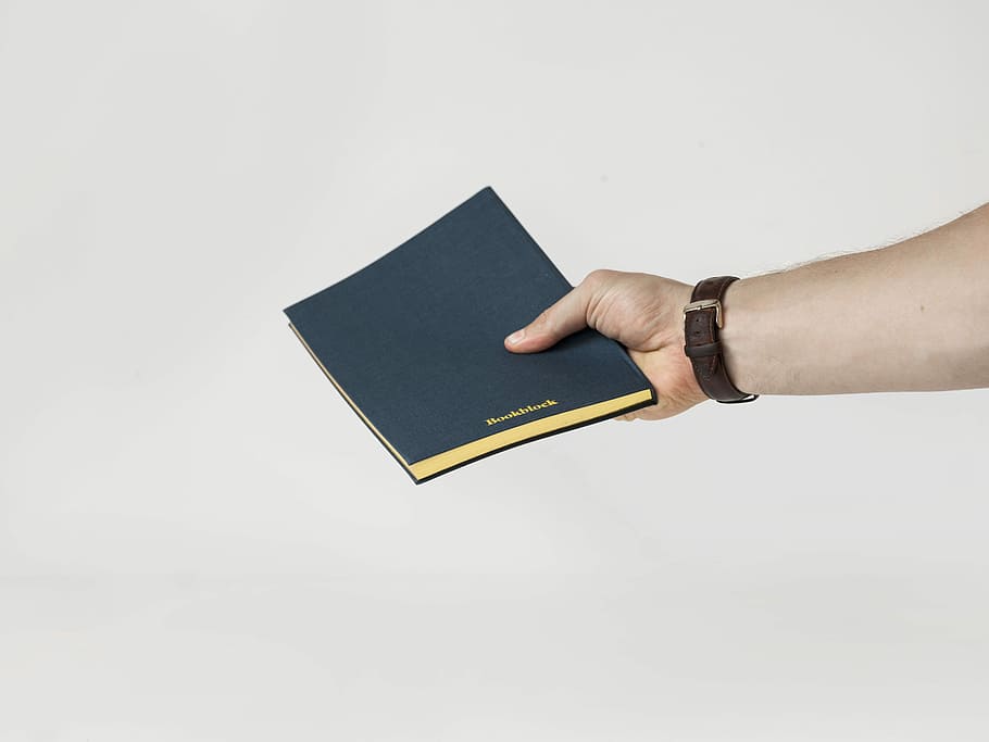 person holding blue book, person holding black book, hand, watch HD wallpaper