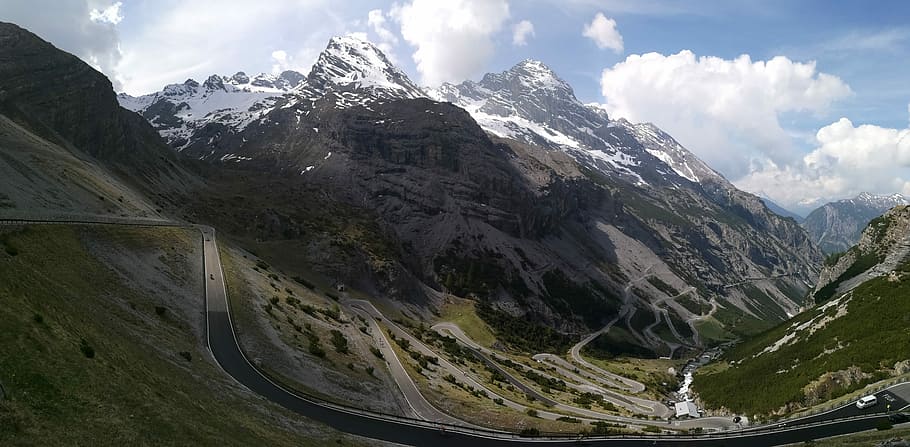 green and gray field with road at daytime, aerial photo of mountain HD wallpaper