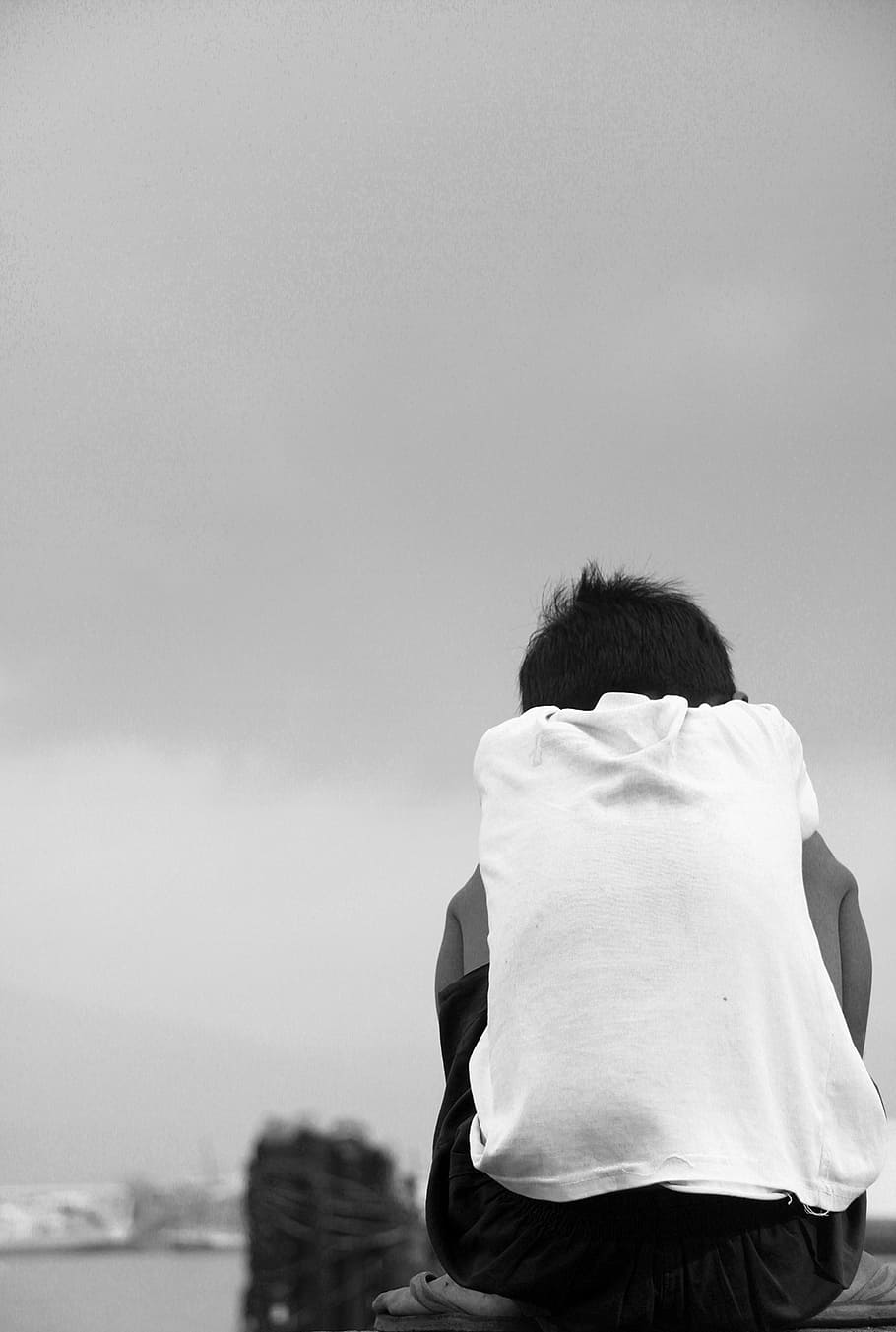 grayscale photography of sitting boy, sky, people, young, childhood HD wallpaper
