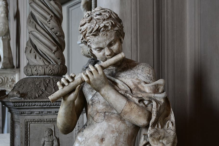 gray concrete person playing flute statue, rome, the museum, the vatican