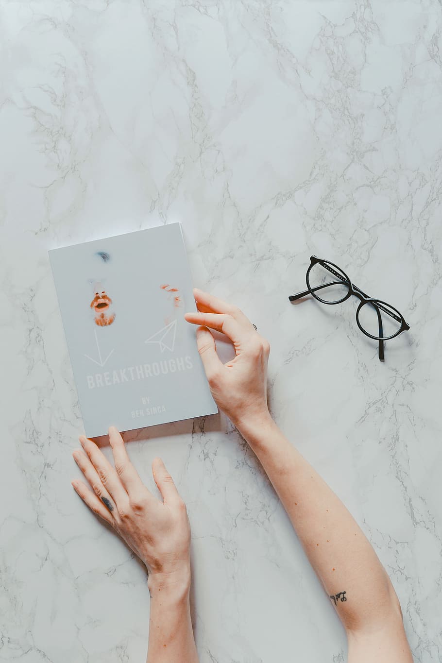 person holding book, person holding Breakthroughs book, human hand HD wallpaper