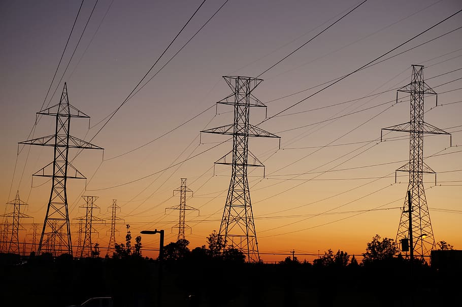 silhouette of cellular towers during sunset, power lines, electricity