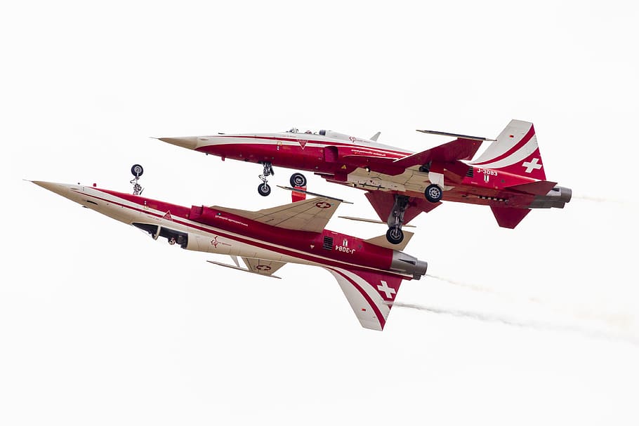 red and white fighting plane, two white-and-red jet performing aerial exhibition HD wallpaper