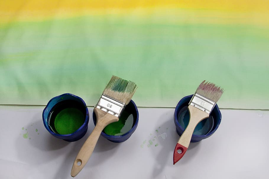 two brown paint brush on blue plastic cups, course, yellow HD wallpaper