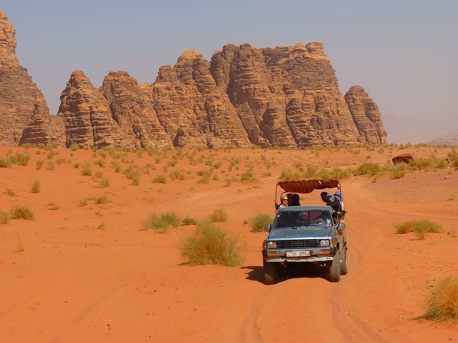 gray pickup truck on desert field, wadi rum, negev, negev desert