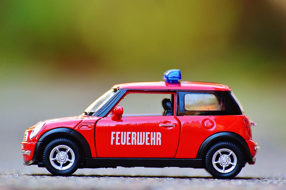 red die-cast car, fire, mini cooper, auto, model car, blue light HD wallpaper