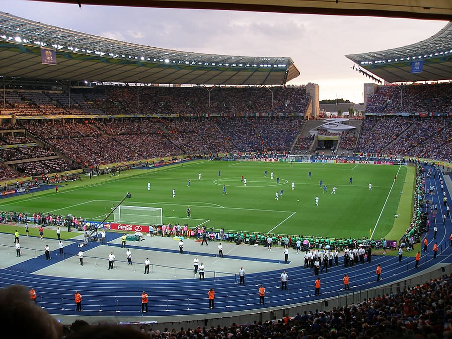portrait photography of soccer stadium during daytime, football stadium