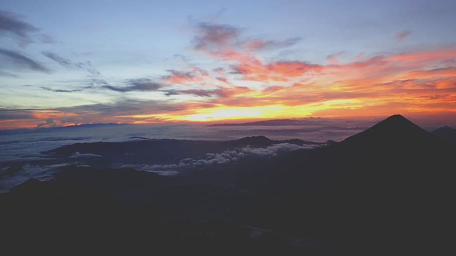 mountain range covered with clouds during sunset landscape photography, silhouette of mountain under sky panoramic photography HD wallpaper