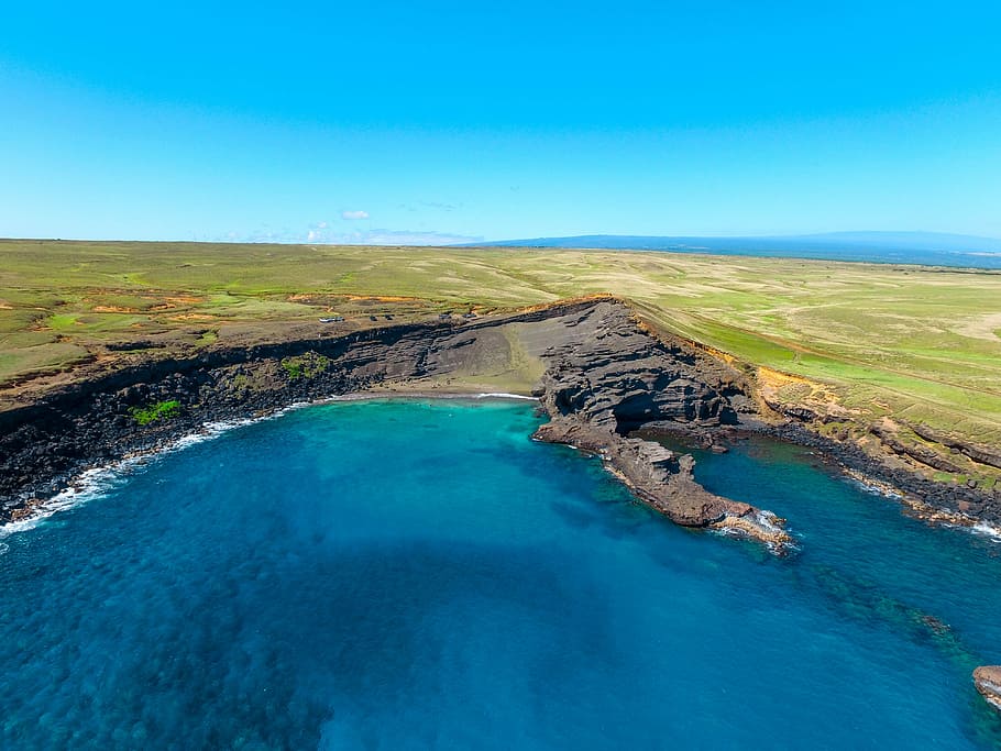 aerial shot of body of water during daytime, body of water near green land HD wallpaper
