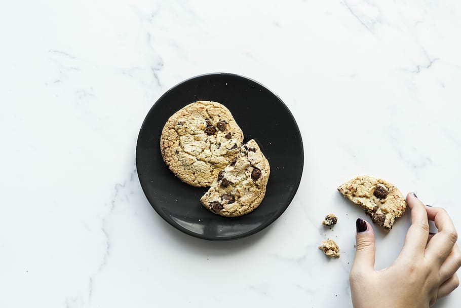 black plate with chocolate chip cookies, snack, marble, hand HD wallpaper