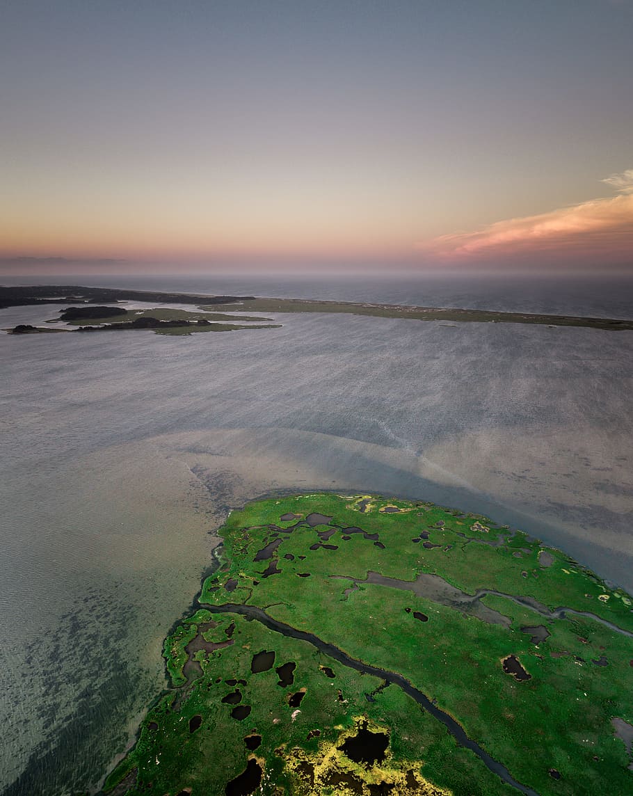aerial view of island, high angle photography of a body of water and island HD wallpaper