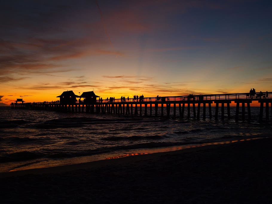 sea dock at golden hour, sunset, panorama, setting sun, water HD wallpaper