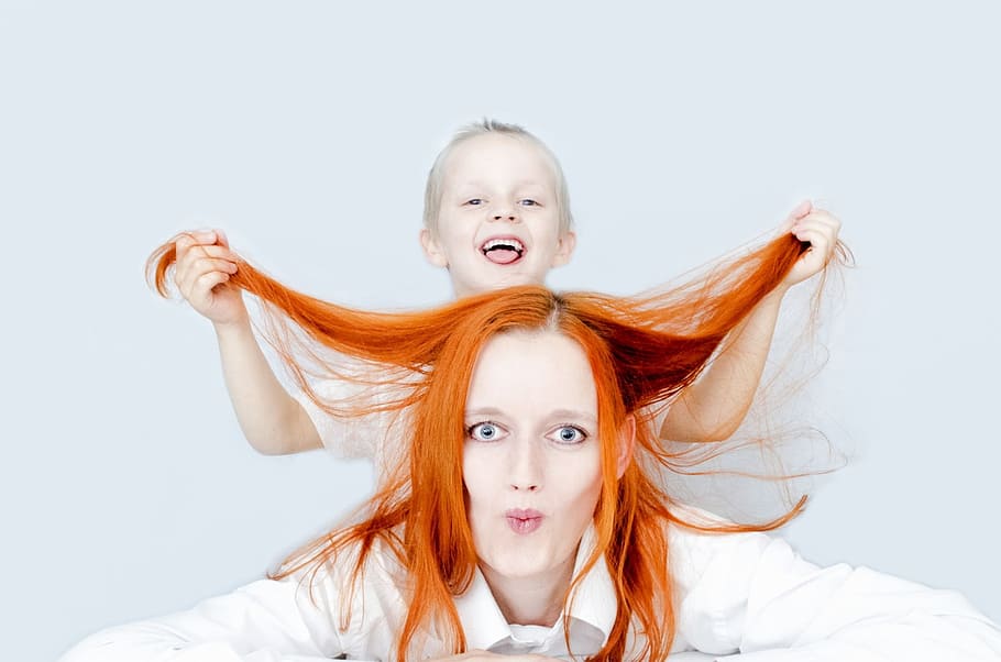 closeup photo of a woman with a boy in her back holding her hair, HD wallpaper