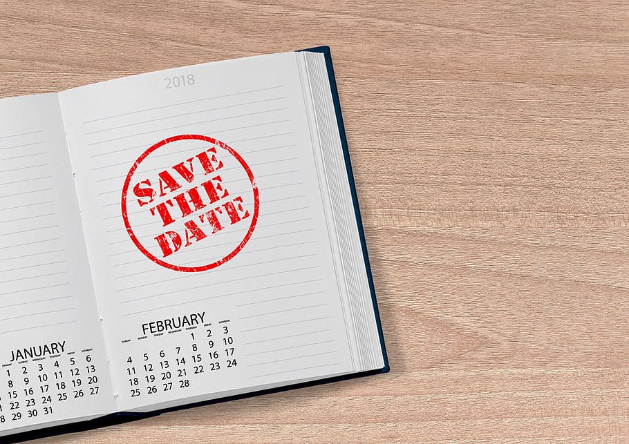notebook with save the date stamp on top of brown wood surface HD wallpaper