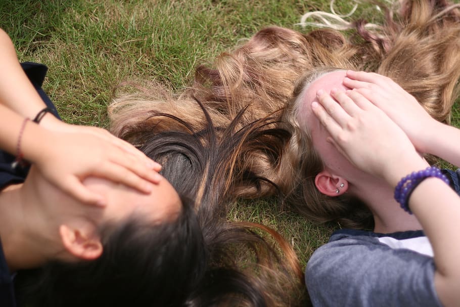spring, girls, hair, grass, two people, lying down, togetherness HD wallpaper