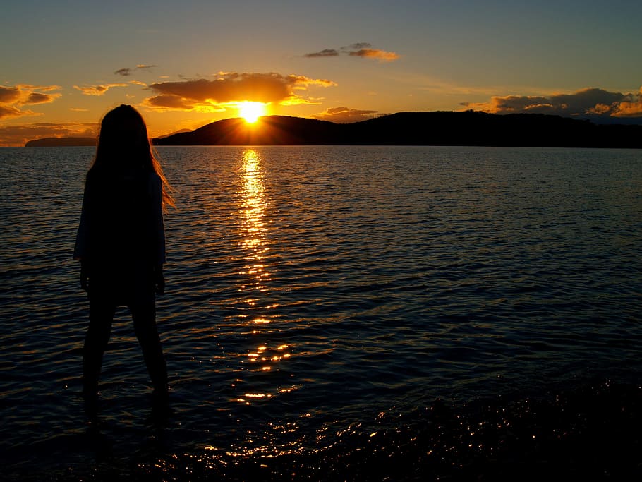 sunset, dawn, water, dusk, silhouetted, girl, evening, sky HD wallpaper