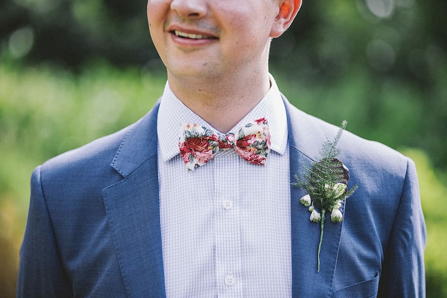 man wearing blue notched-lapel blazer with red and white bowtie at daytime, man standing in shallow photography, HD wallpaper