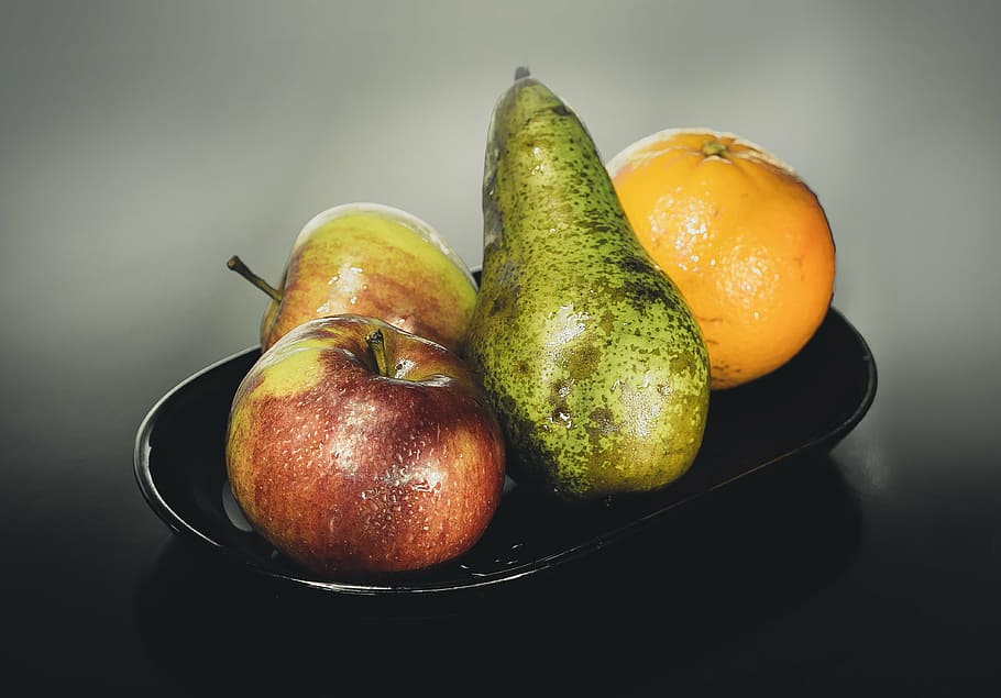 two apples, avocado, and orange on black ceramic plate, studio HD wallpaper