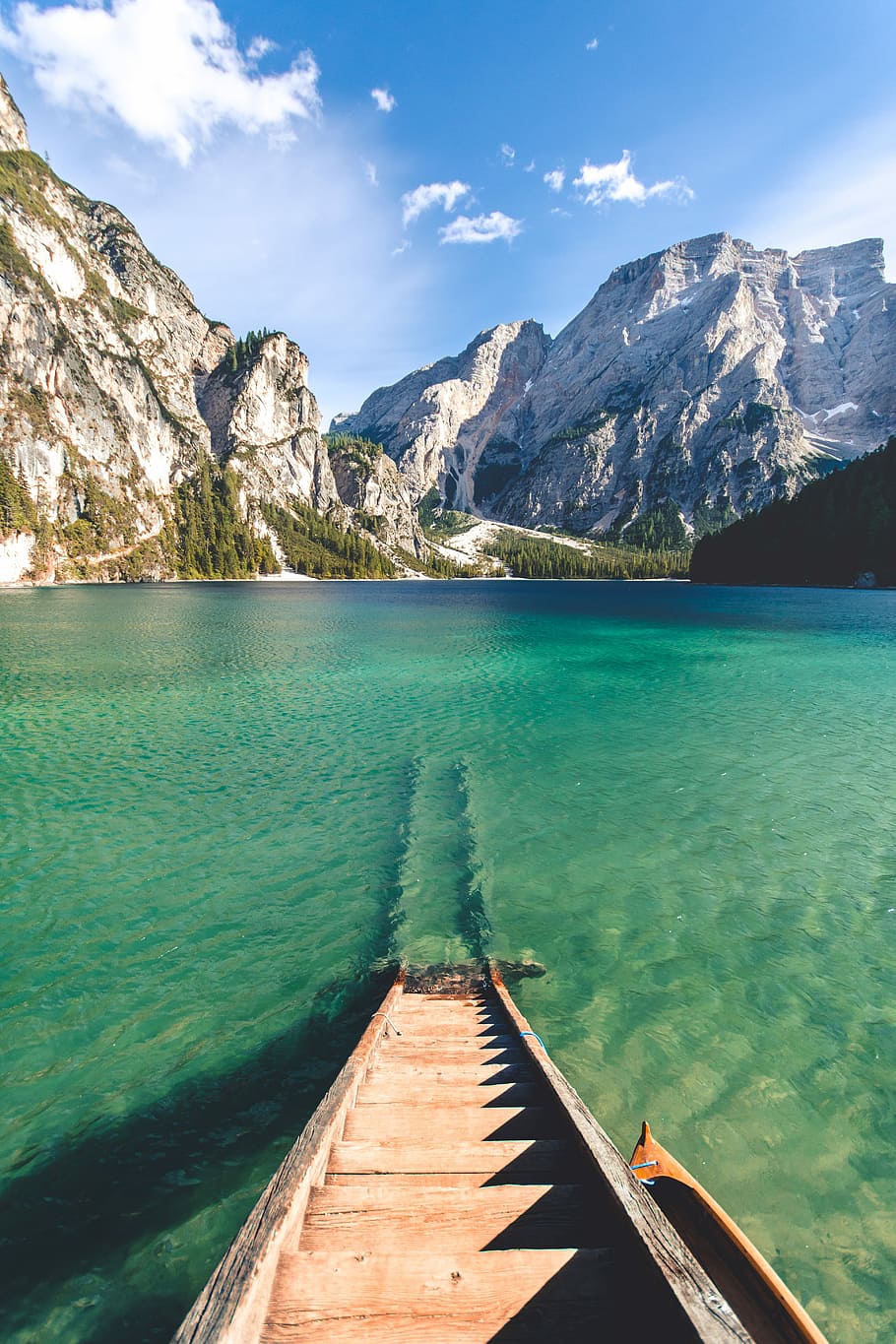 brown wooden wooden ladder submersed in body of water with rocky mountain ahead under white and blue sky, brown wooden stairs near body of water and ice-capped mountain during daytime HD wallpaper
