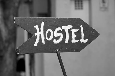grayscale photography of wooden hostel road signage, youth hostel HD wallpaper