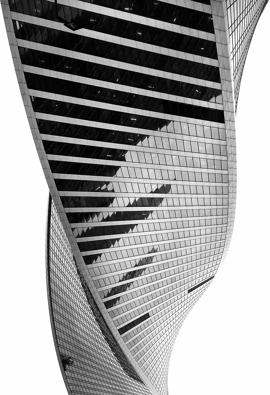 architectural photography of building, grayscale photo of twisted glass building HD wallpaper