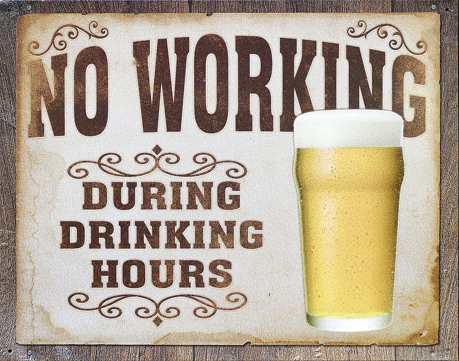 No Working During Drinking Hours signage, beer advertising, shield