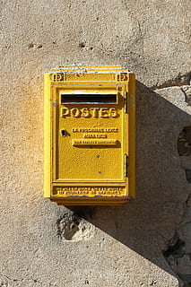 yellow steel mail box mounted on gray wall, yellow metal mail box HD wallpaper