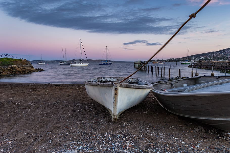 white and grey boats on sand in front of body of water, white and gray boats in coastline HD wallpaper