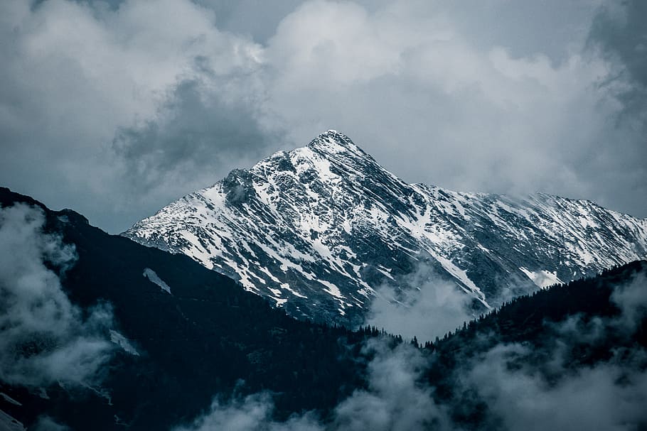 mountain alps, snow-covered mountains under gray cloudy sky during daytime HD wallpaper