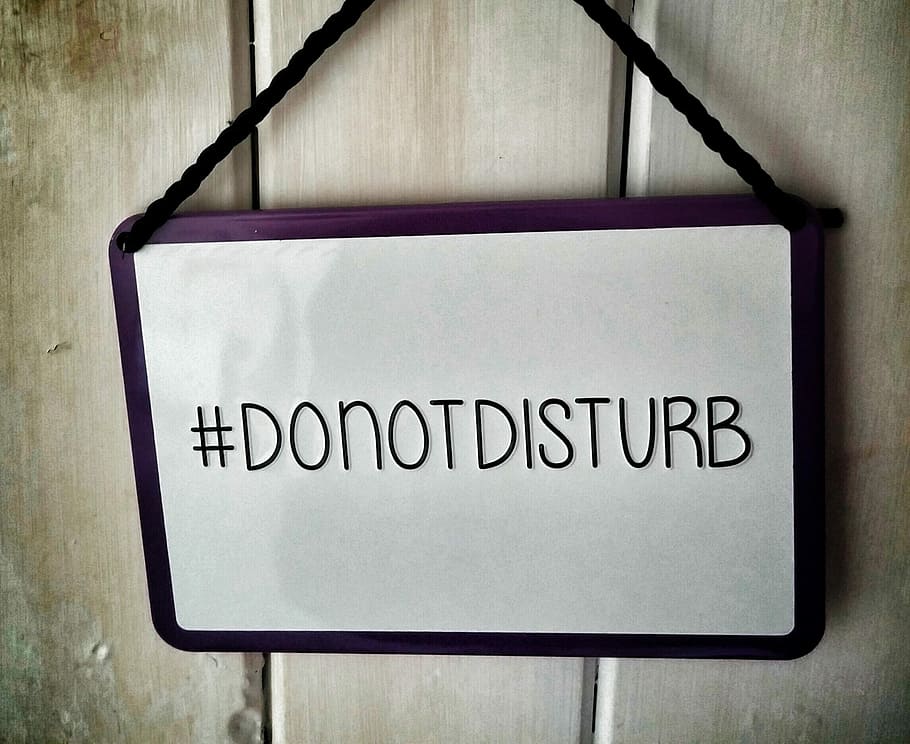 white and black Donotdisturb signage, do not disturb, notice