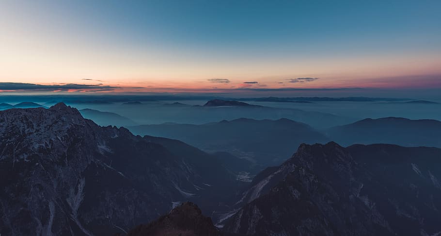 aerial photography of mountains covered with white fog, top view of mountains across horizon HD wallpaper